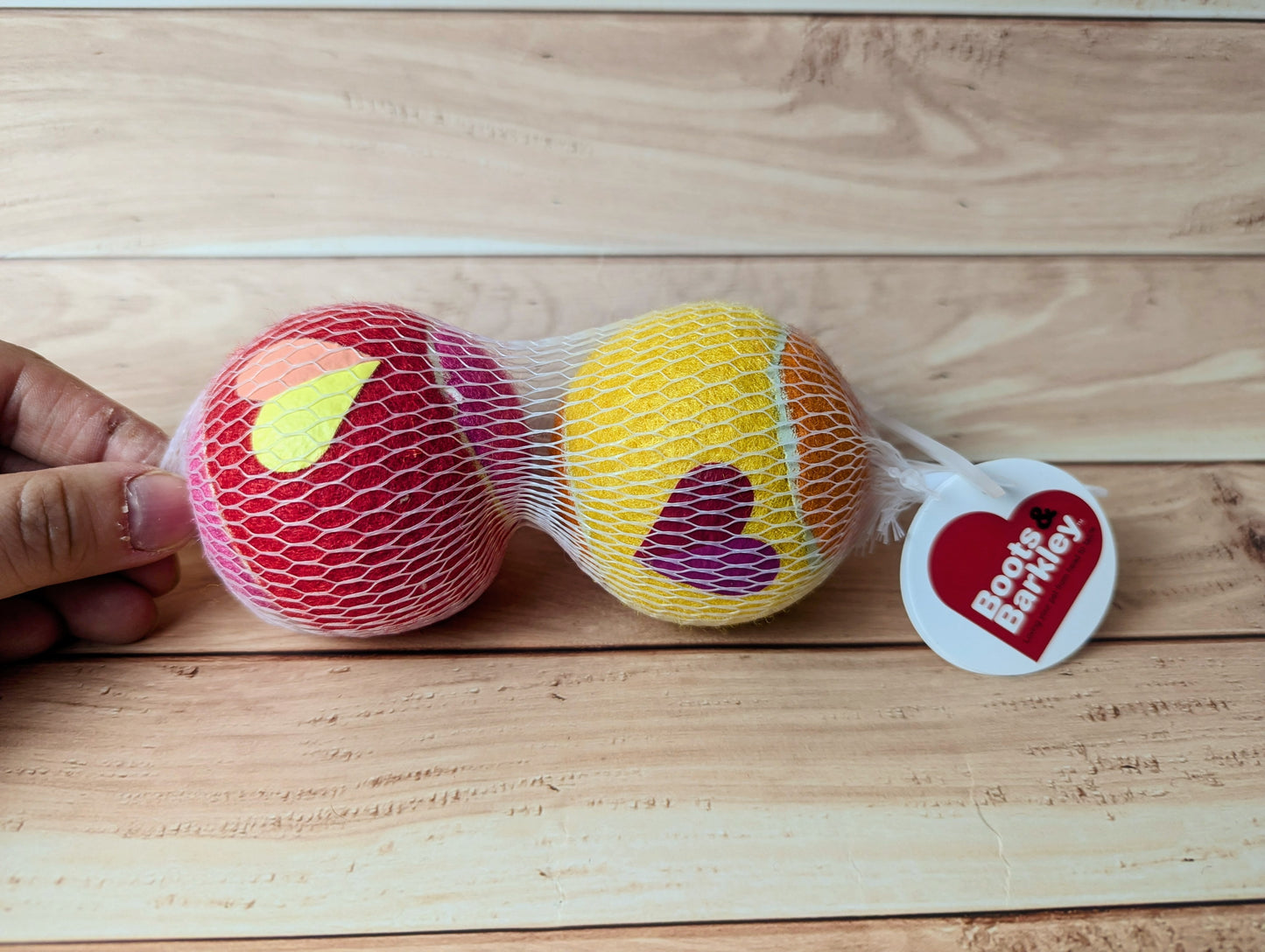 Boots and Barkley Valentine's tennis balls